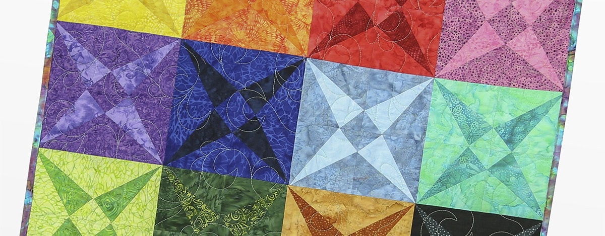 How to Create an Eye-Catching Rainbow Cross Canoe Quilt