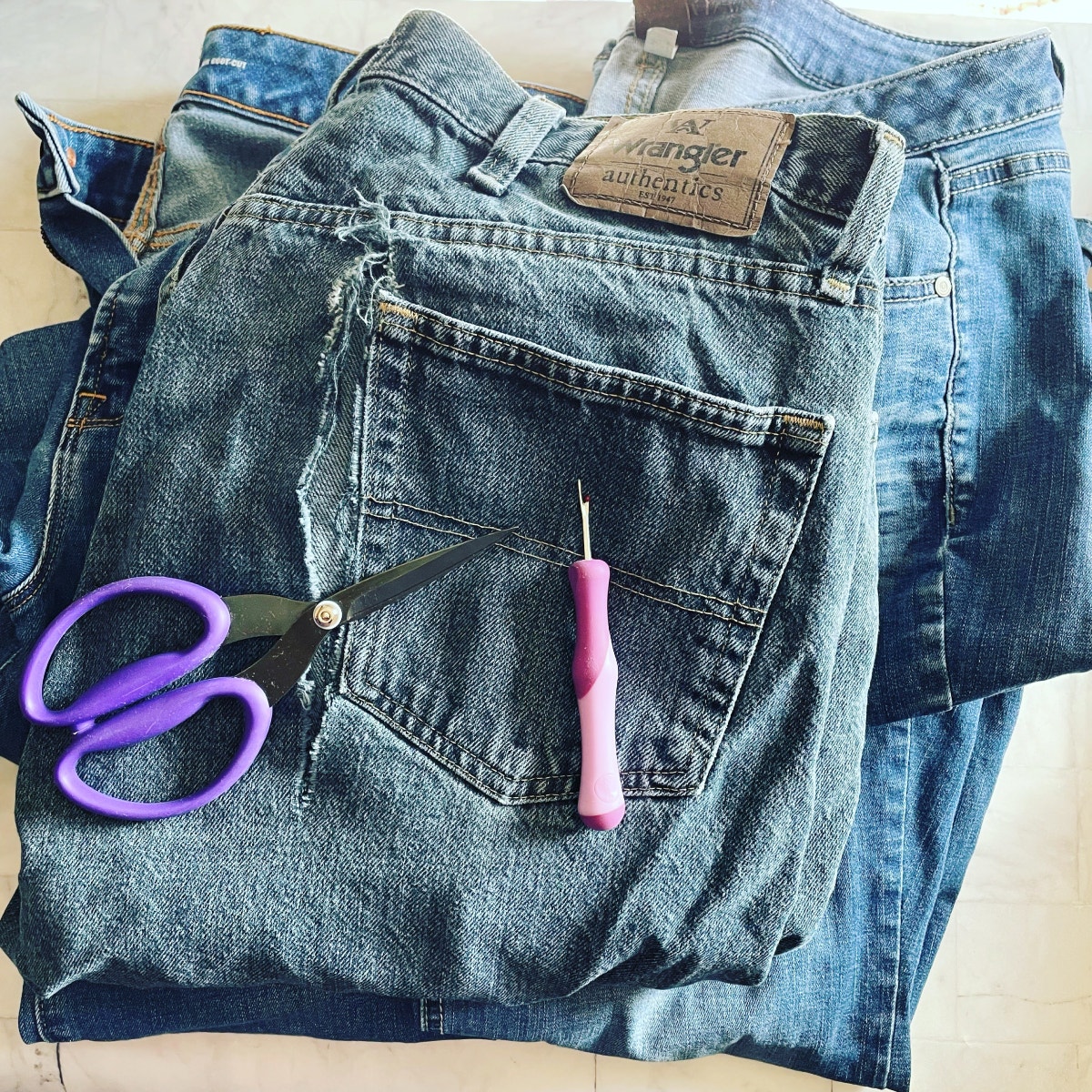 A Pair of Damaged Jeans to Use for An Upcycled Denim Quilt